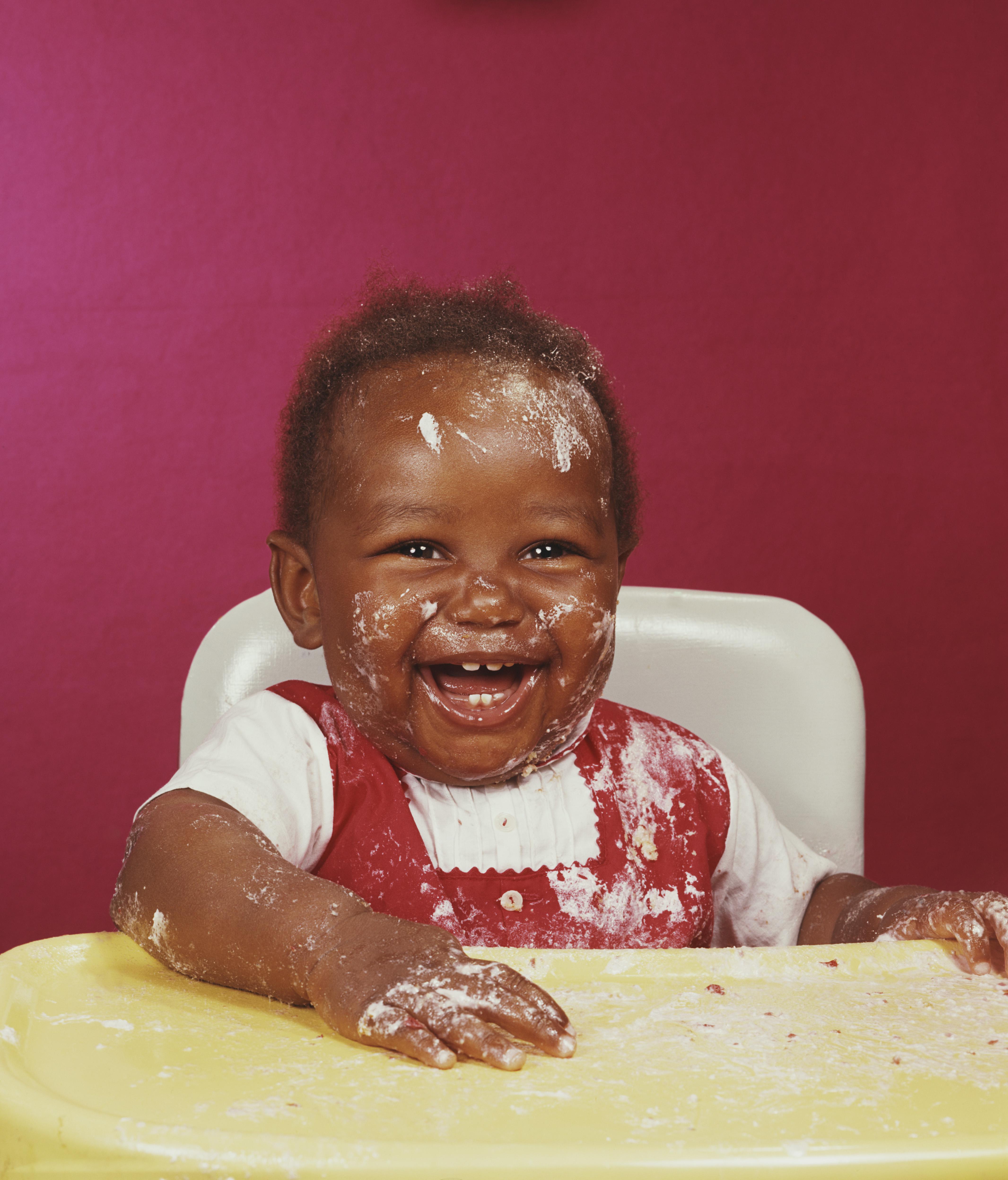 Smiling baby with messy face
