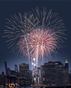 Fourth of July celebration over New York skyline at night
