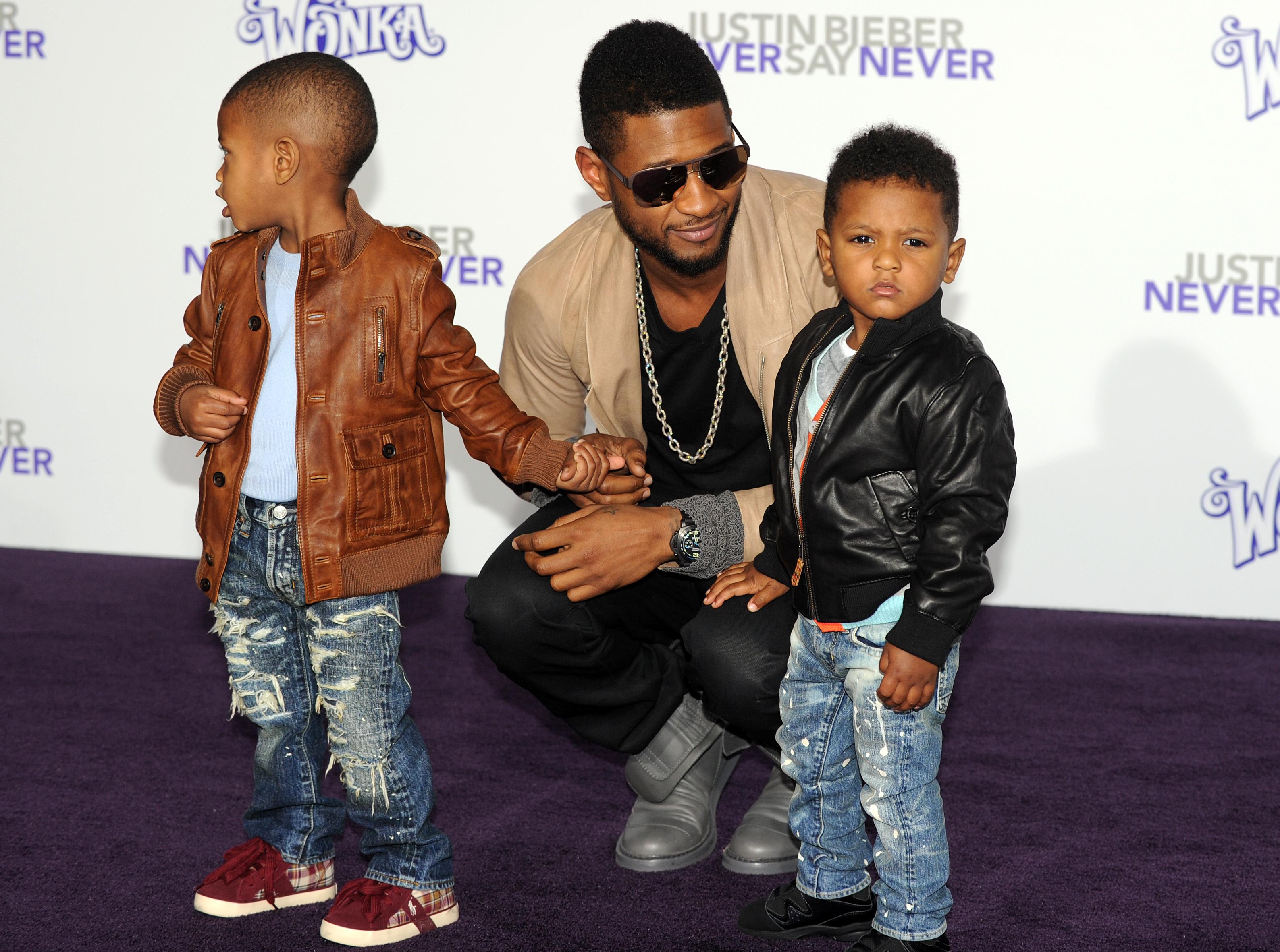 Singer Usher arrives with his children a
