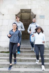 Friends jogging under Pont Neuf bridge, Paris