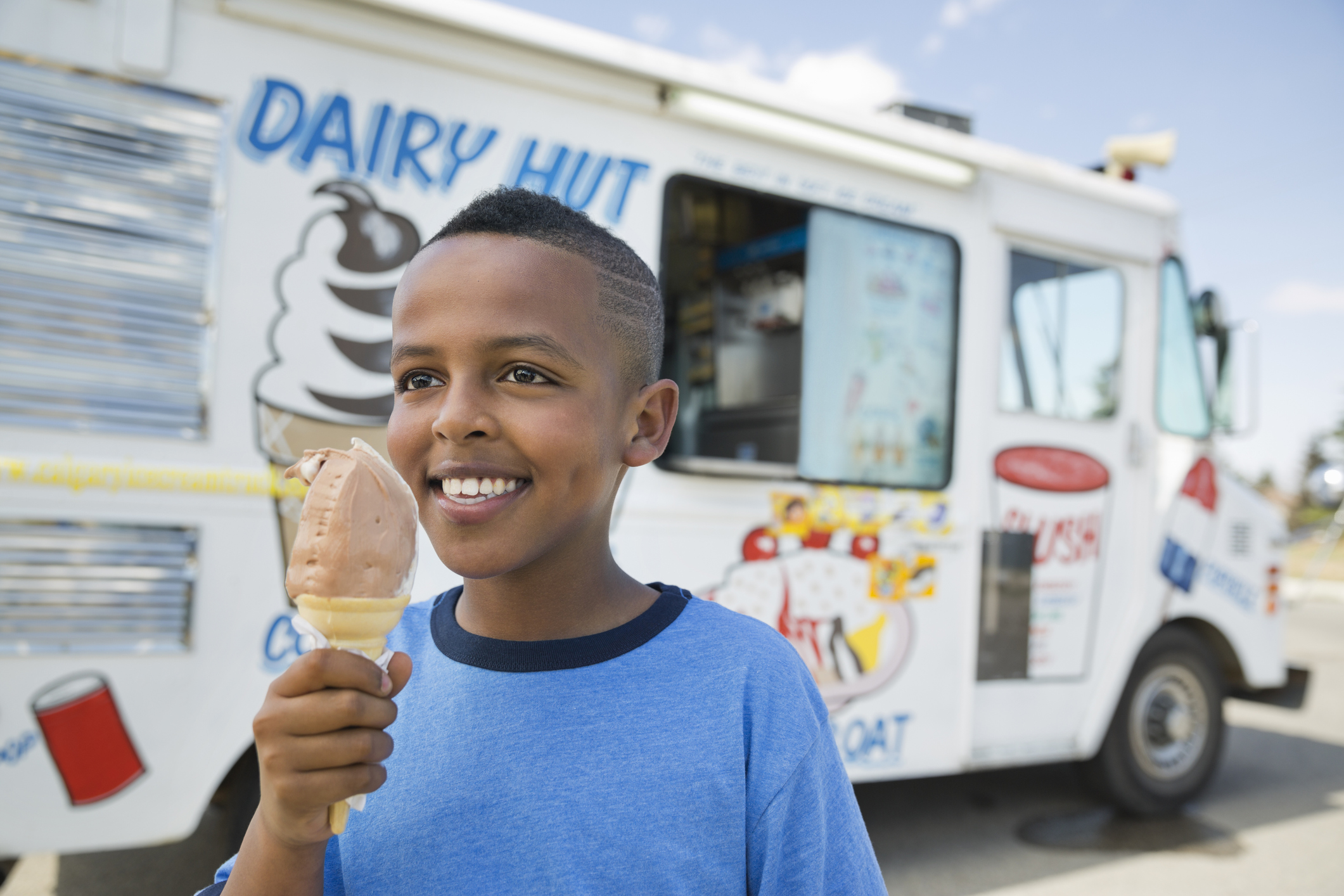 Boy standing with ice cream cone