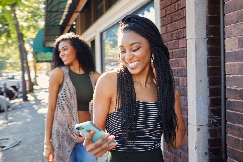 Young women explore a city