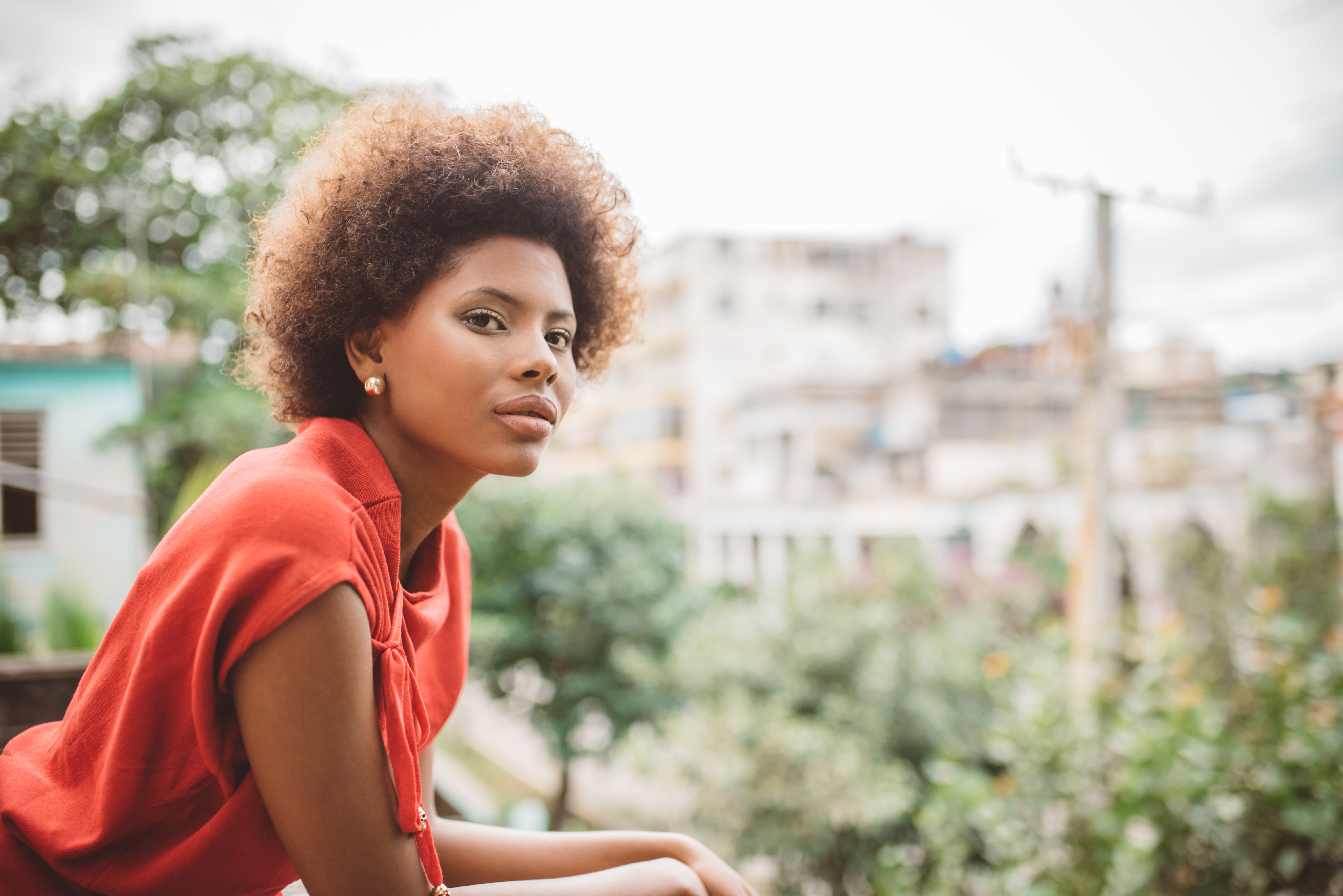 portrait of beautiful young cuban woman on balcony in Havanna