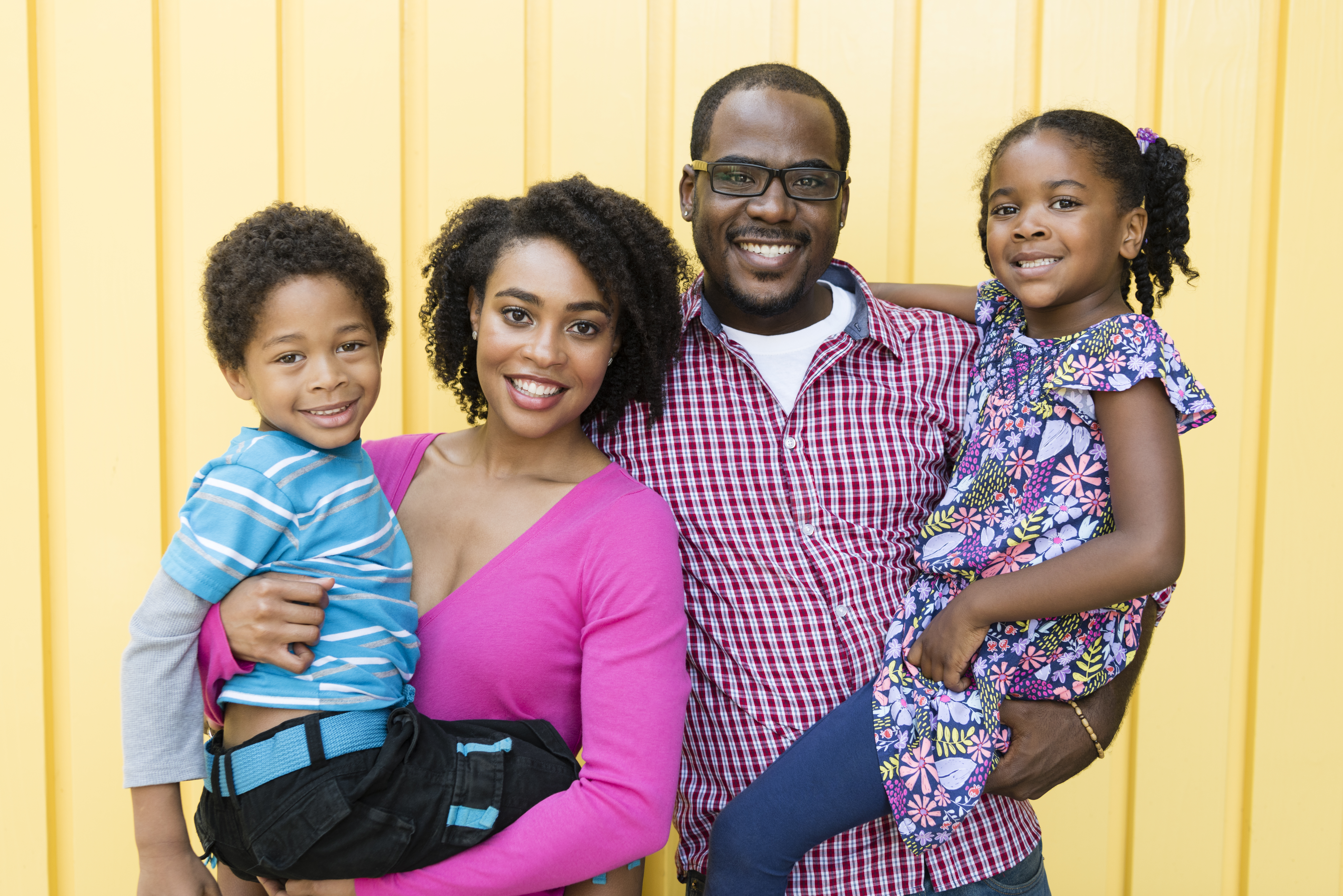 African American family smiling to the camera, portrait