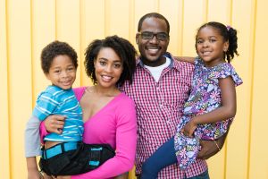 African American family smiling to the camera, portrait