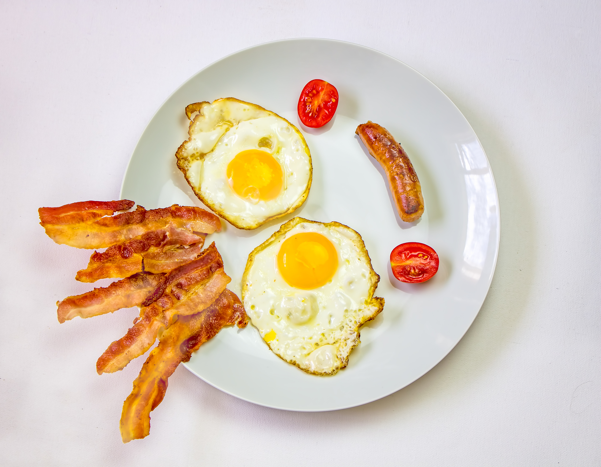 Irish breakfast on table prepared for eating in bed.