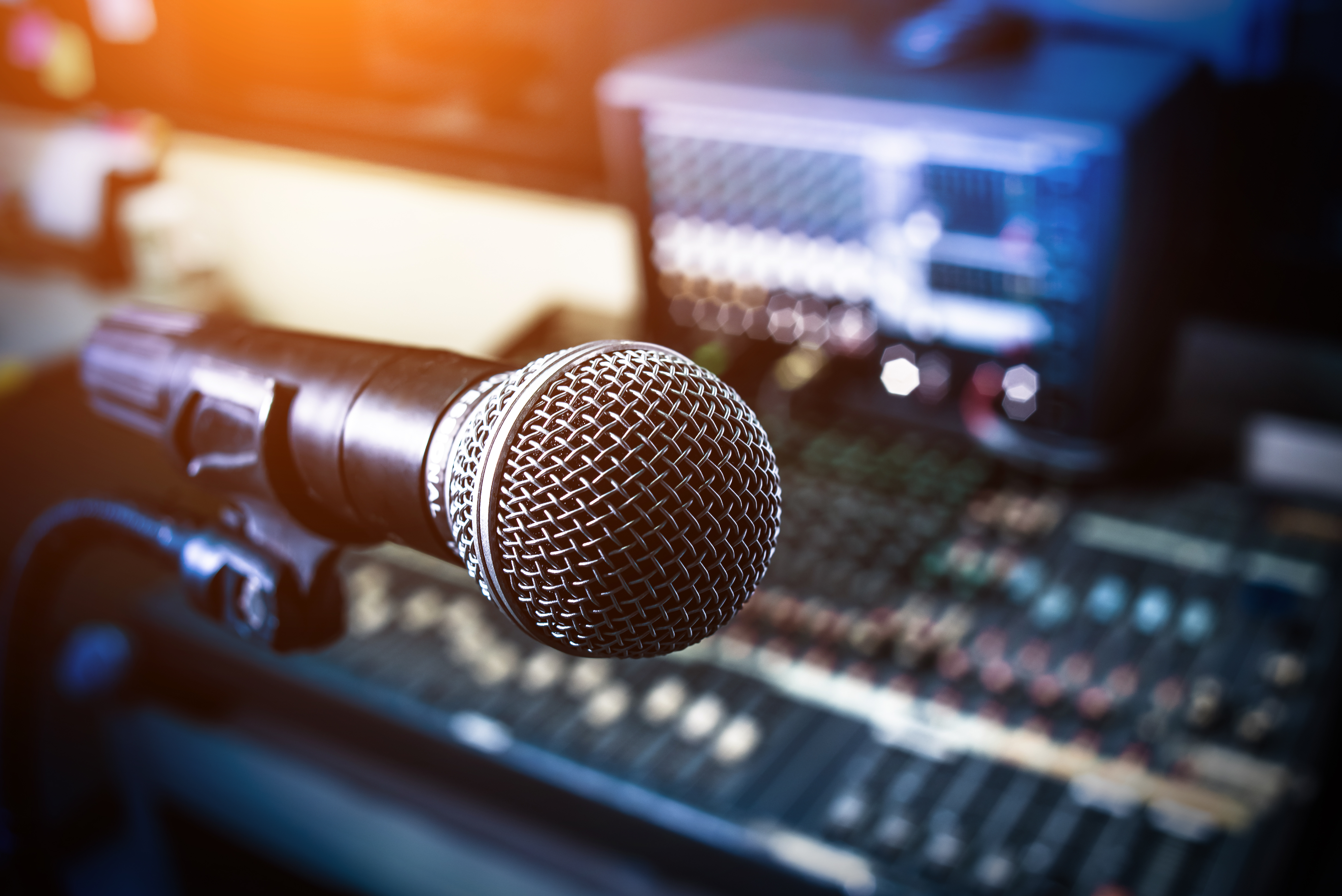 Microphone over the Abstract blurred on sound mixer out of focus background