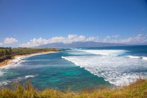 Layers of waves atop blue water in Maui, Hawaii