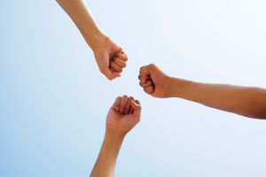 Hands reaching to sky