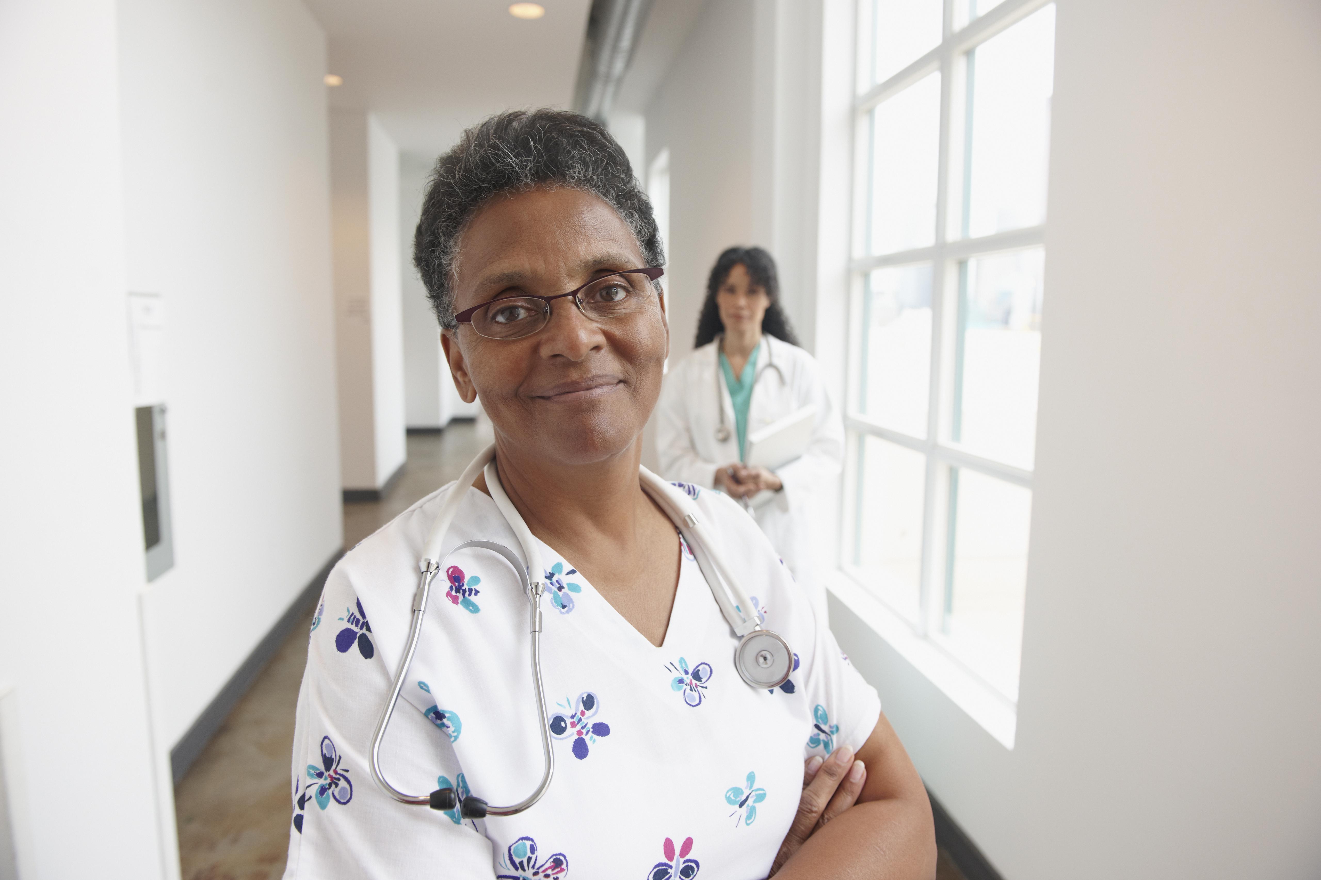 African American nurse in hospital hallway