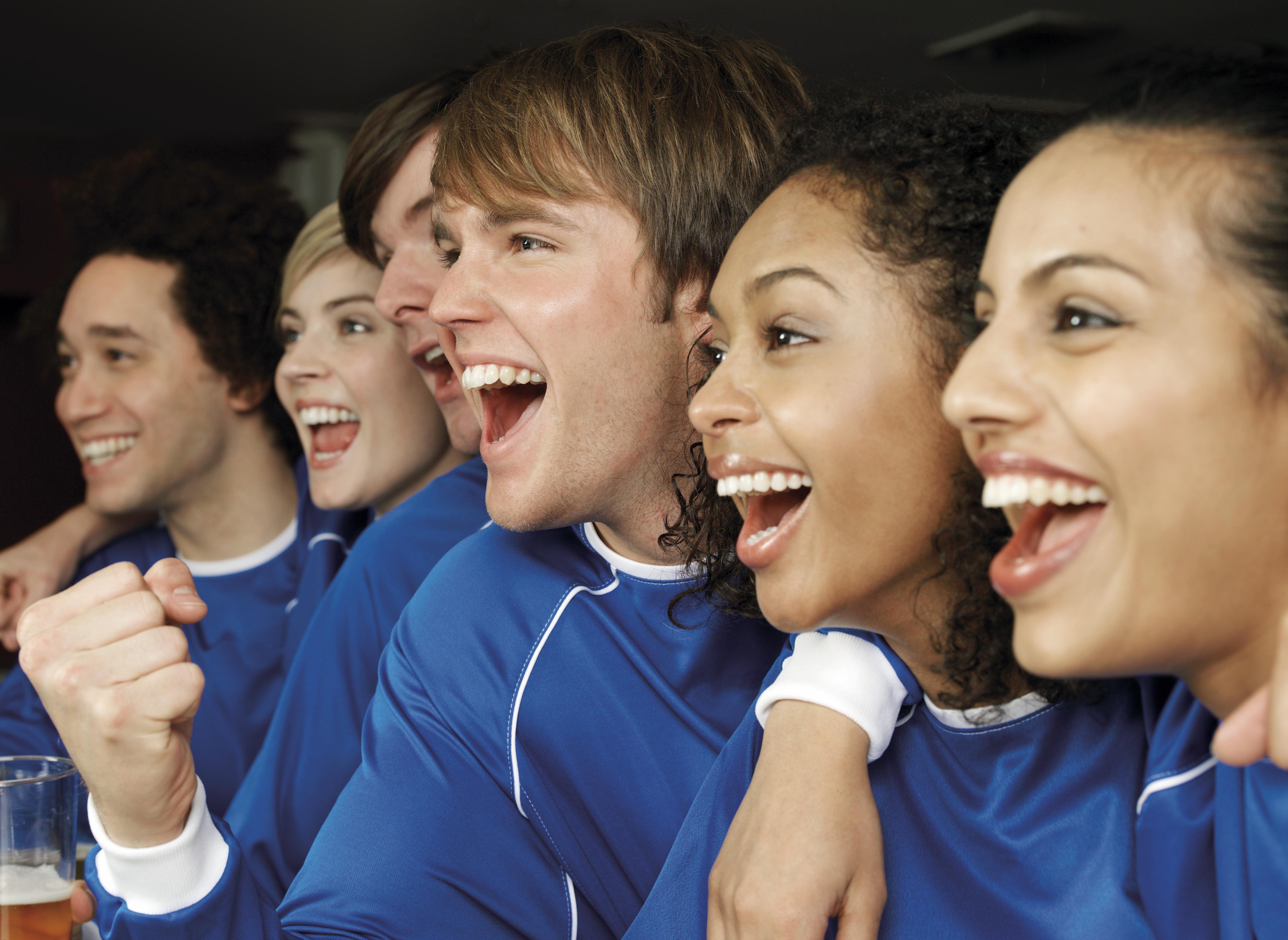 Group of Soccer Fans Cheering