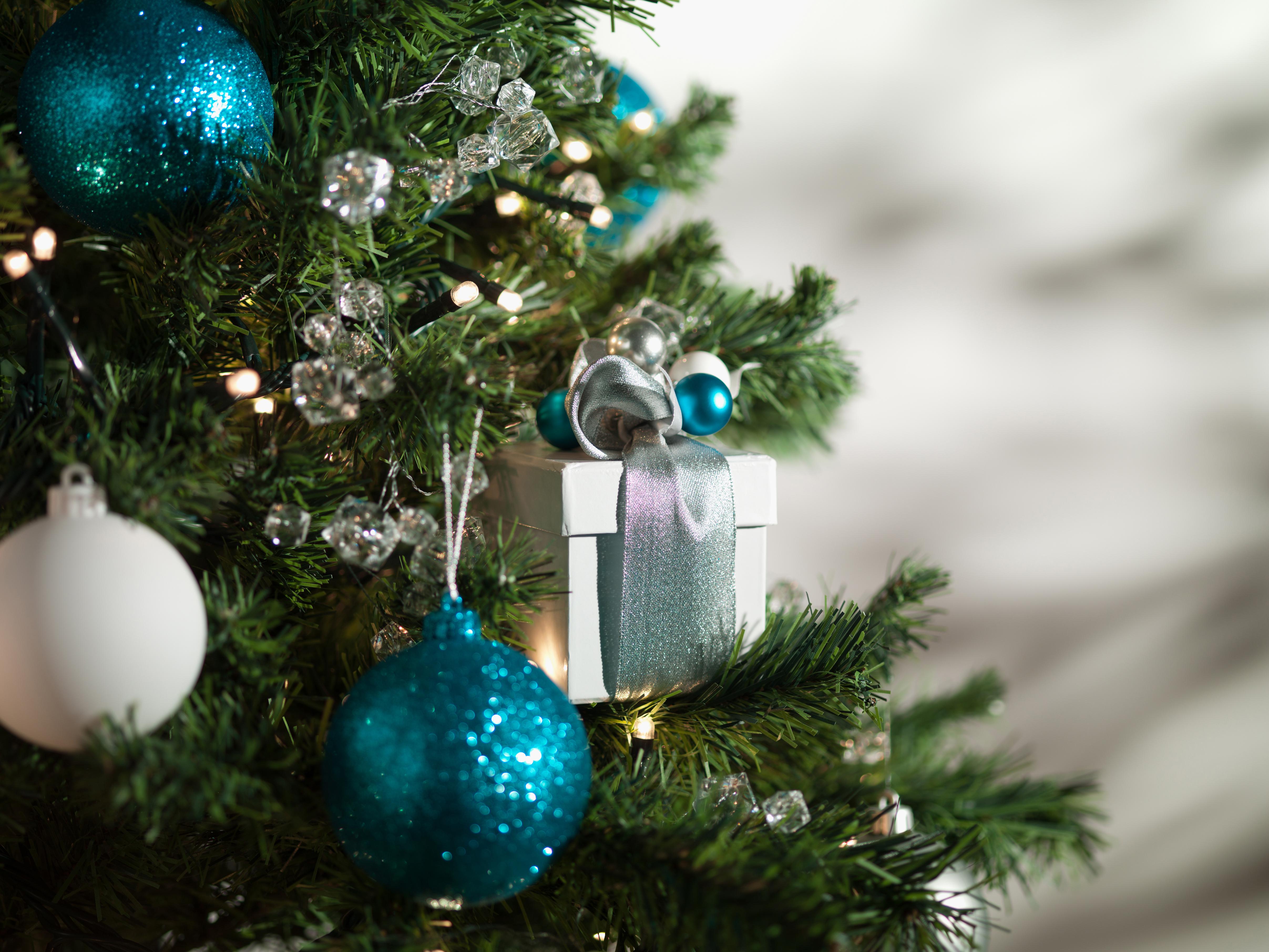 Christmas gift and ornaments on tree