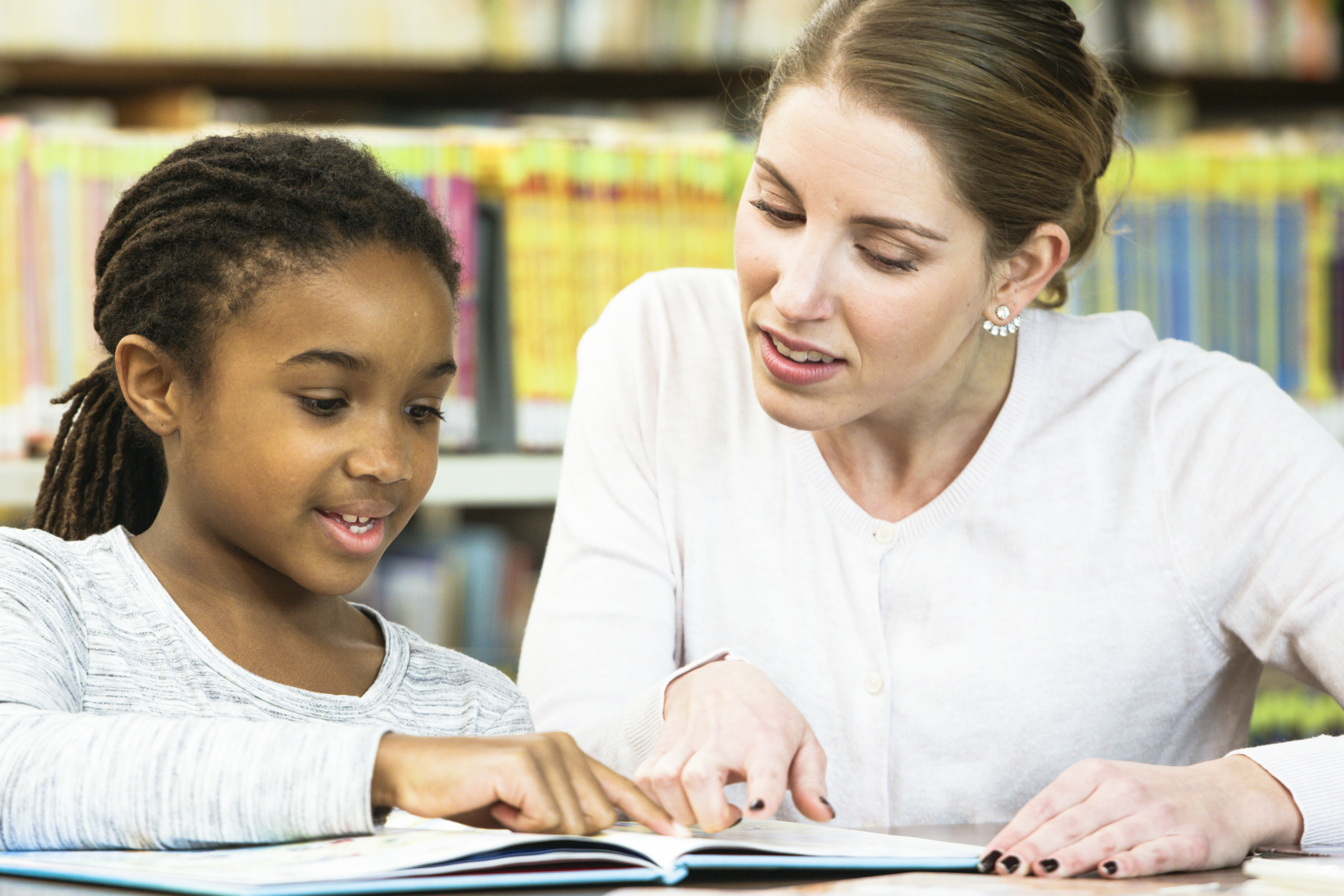 Teacher Helping Student