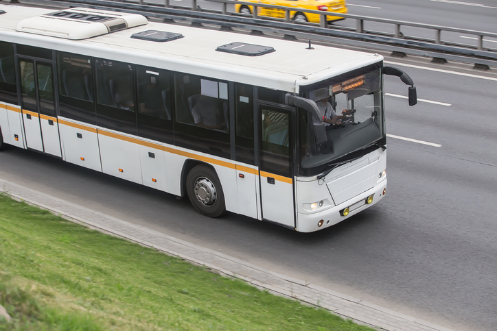 Bus moves along the street