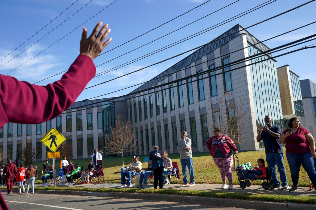 DURHAM, NORTH CAROLINA - NOVEMBER 5: Parade-goers watch as U.S.
