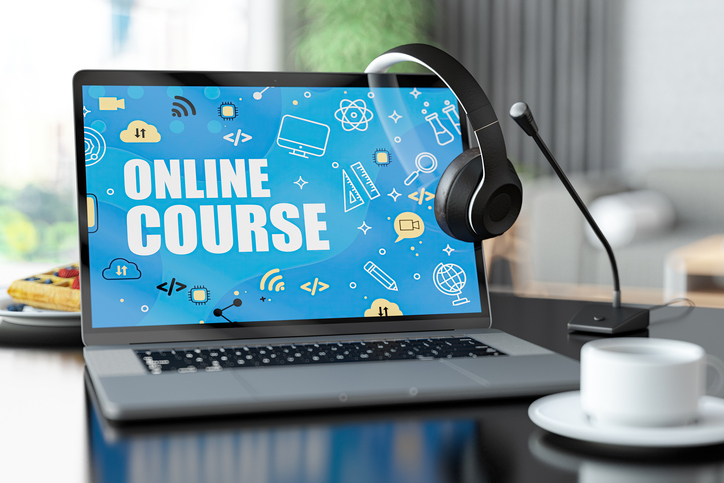 Online Course Concept with a Laptop with Headphones and Microphone at Home