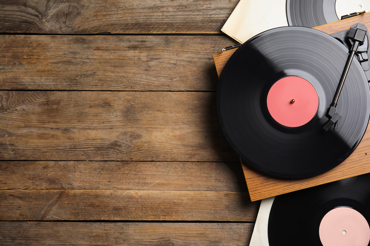 Vinyl Record on Turntable with Wood Background, Top View